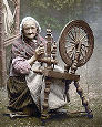 old woman at spinning wheel